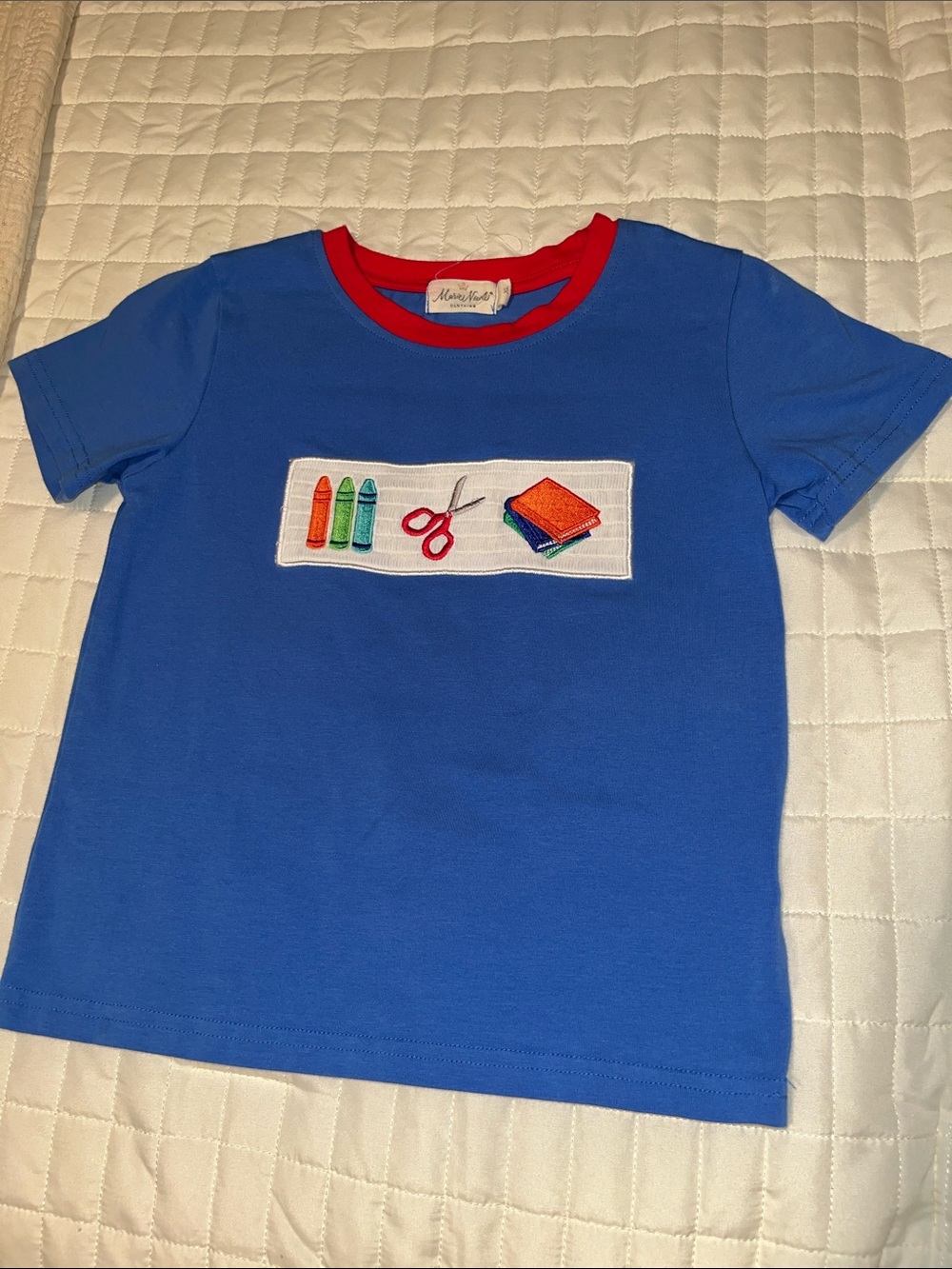 Adorable boutique blue tee with red neckline and school-supply appliqué